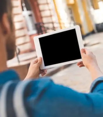 Cropped shot of man using tablet with blank screen
