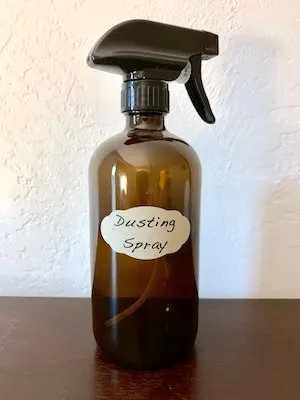 Glass spray bottle of DIY dusting spray
