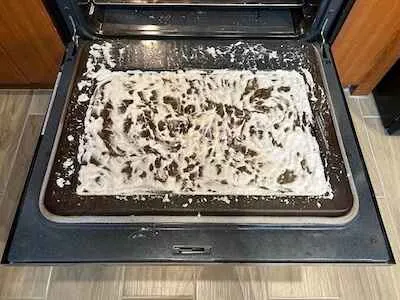 Homemade non-toxic oven cleaner on oven door