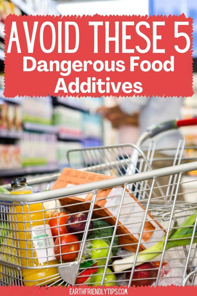 Picture of a shopping cart filled with food in a grocery store aisle with text overlay Avoid These 5 Dangerous Food Additives